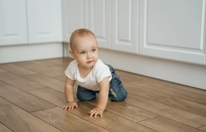 kid-white-tshirt-crawls-kitchen-floor